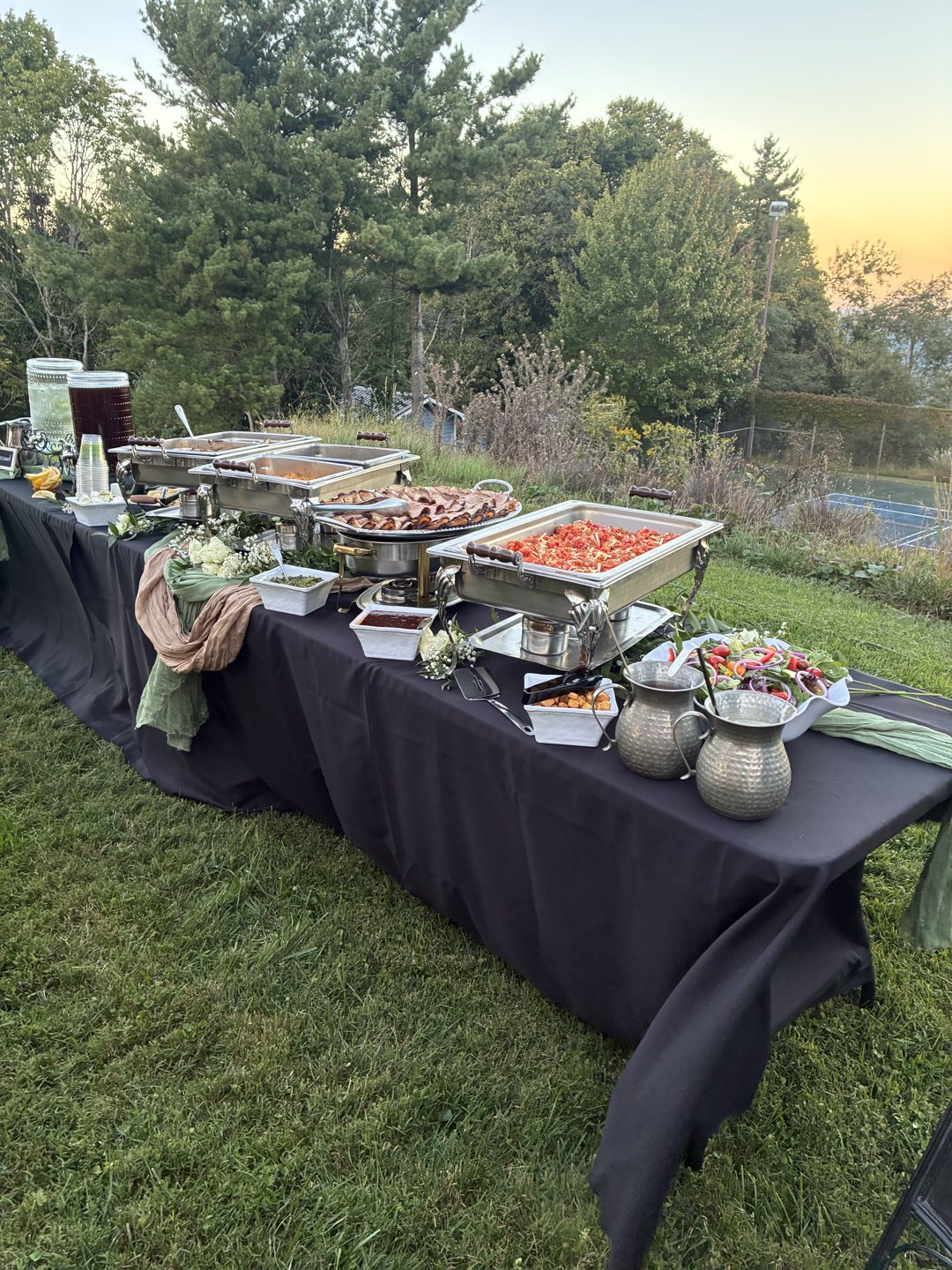 Full outdoor buffet spread prepared for a mountain event