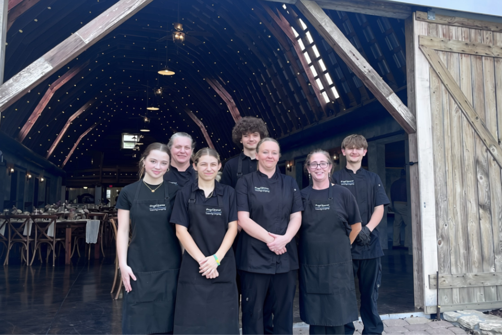 The Frugal Gourmet Catering Company team standing together at a venue